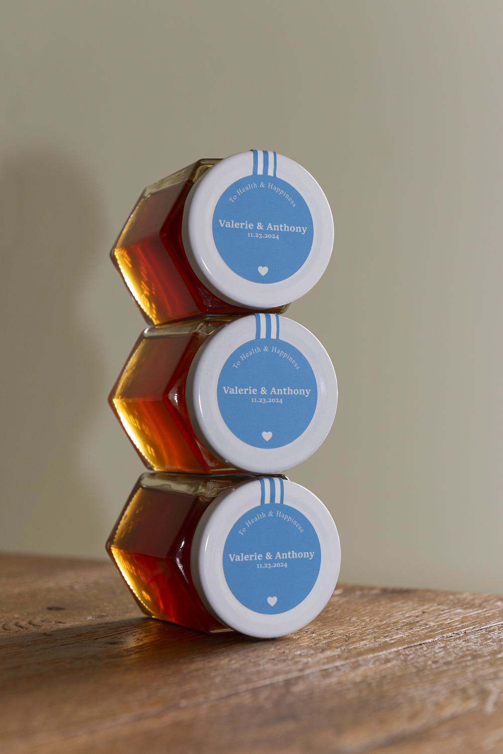 Three Arma Greek Thyme personalized gift honey jars with stacked in a tower