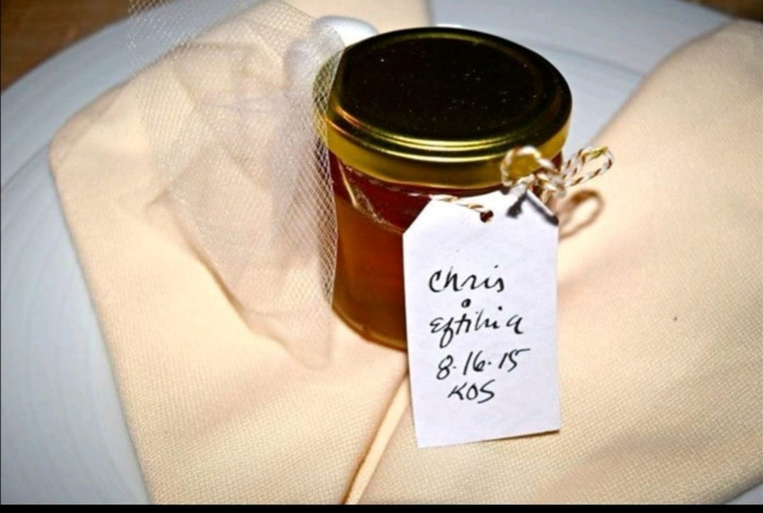 Home made jar of honey with hand written label noting Chris and Eftihia