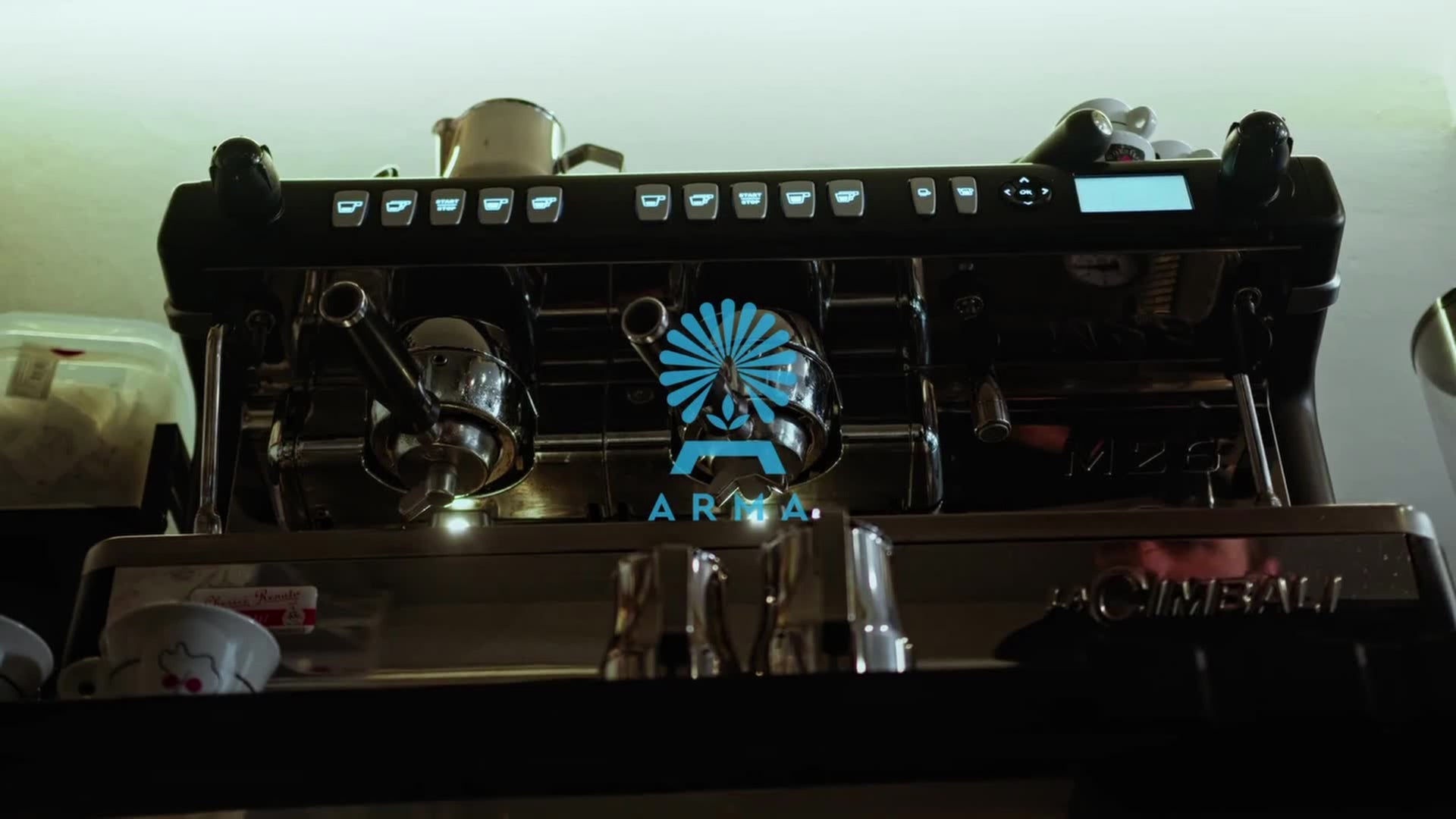 Load video: Professional barista brewing coffee adding Arma honey to sweeten